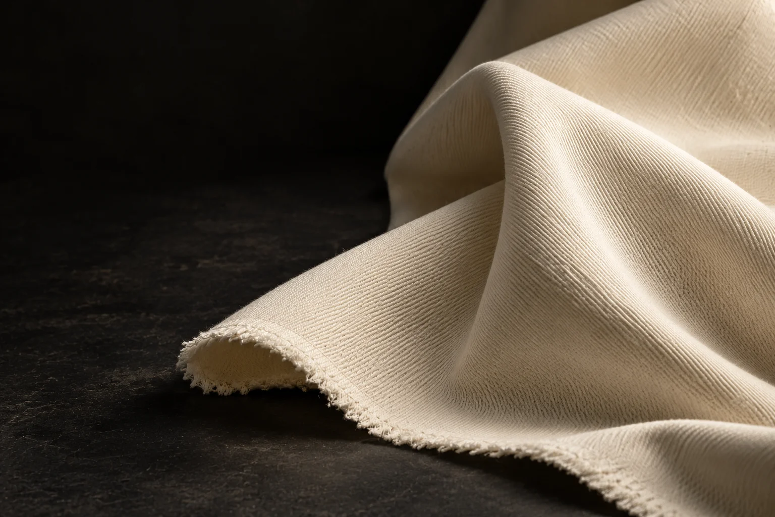 Sculptural folds and the tactile twill weave of the chalk cotton study.